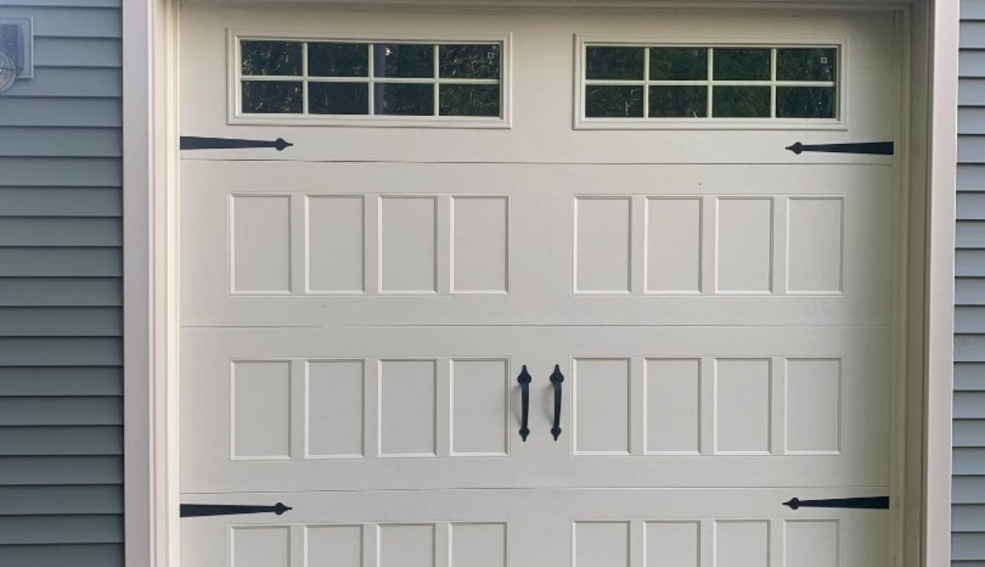 A white garage door, exemplifying a sleek and sophisticated design.