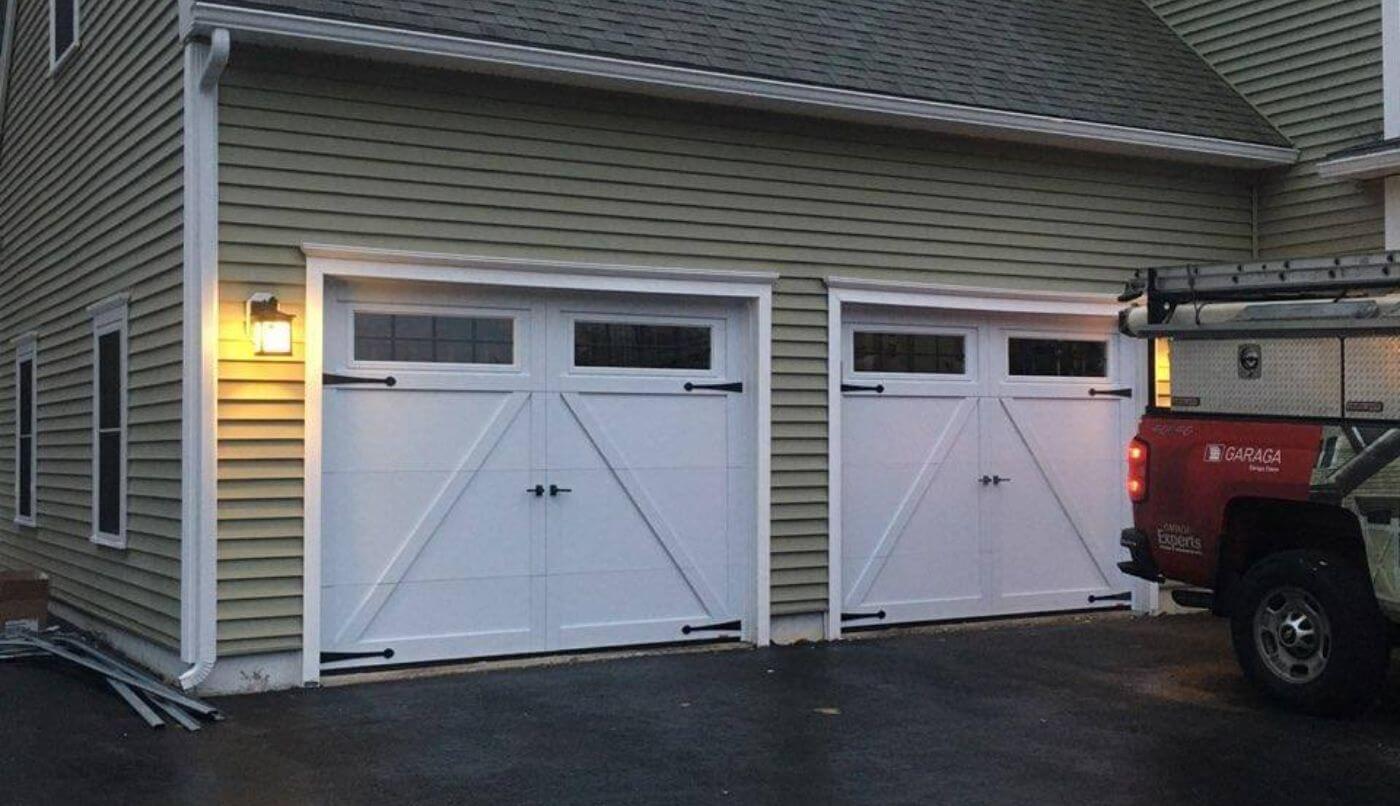 Two white garage doors, exemplifying a sleek and sophisticated design.